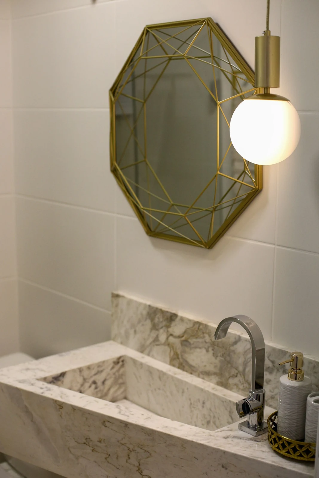 Bathroom basin beneath a wall mirror