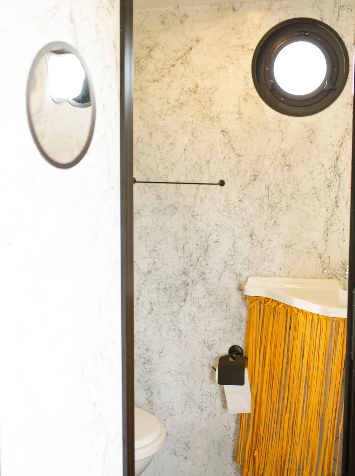 Bathroom mirror and hanging towel