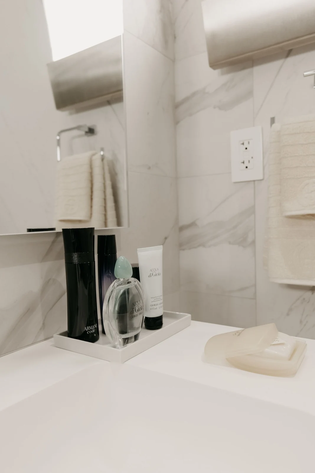 Minimalist bathroom sink with toiletries and a clean, modern design