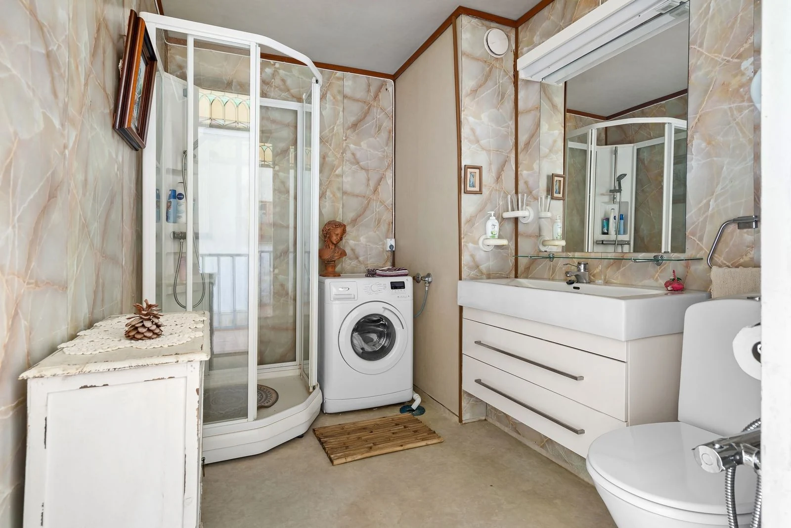 Small bathroom with useful cabinet storage