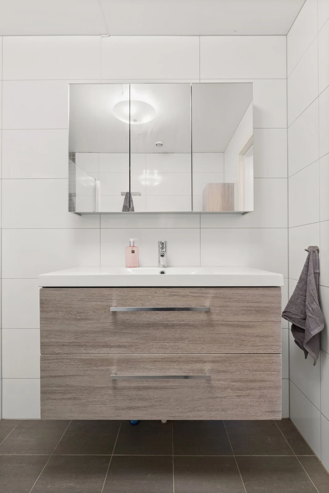 Wood vanity and bathroom mirror