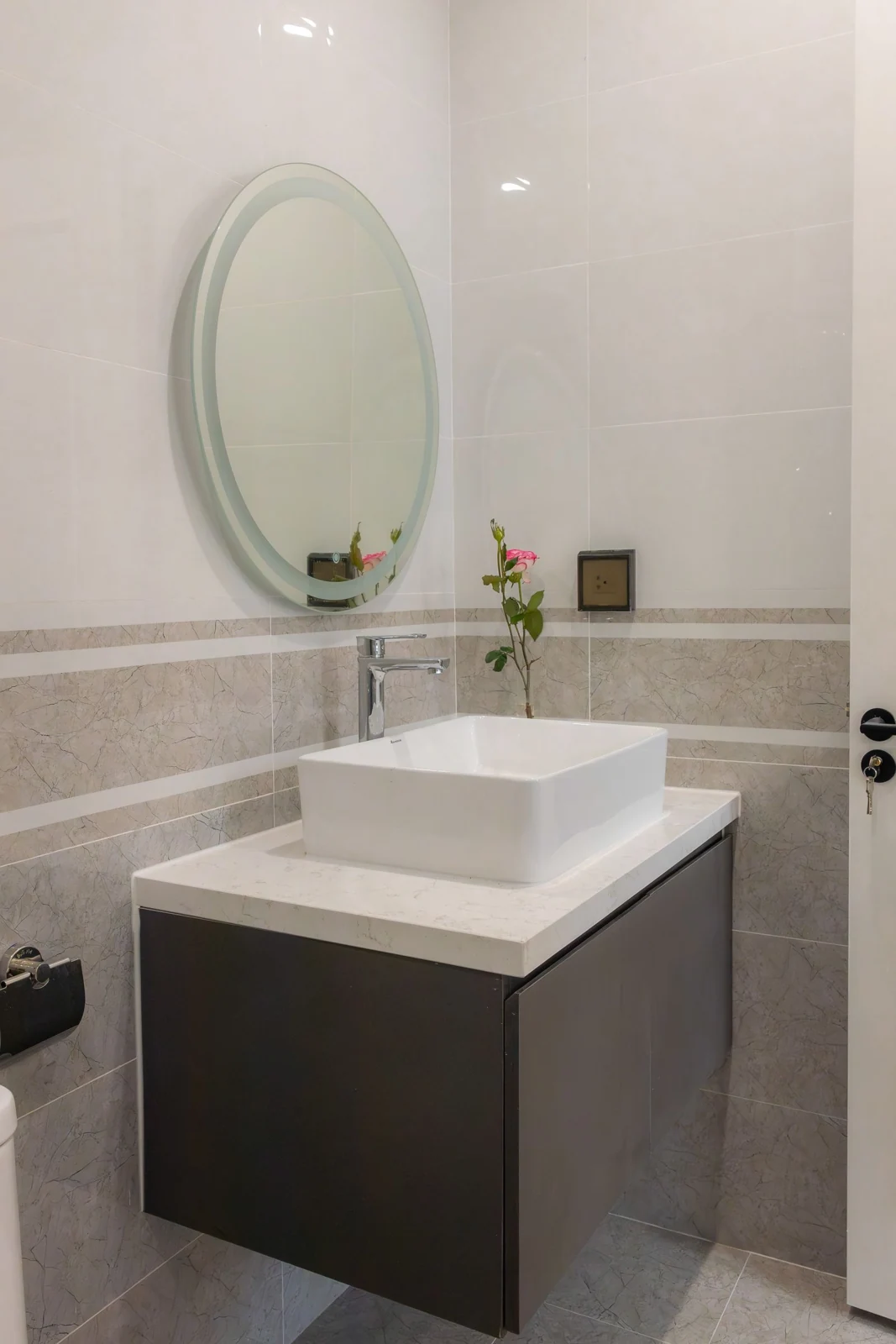 Bathroom basin on a dark vanity