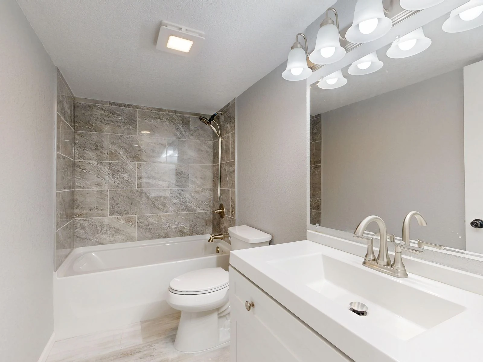 Compact bathroom vanity and toilet