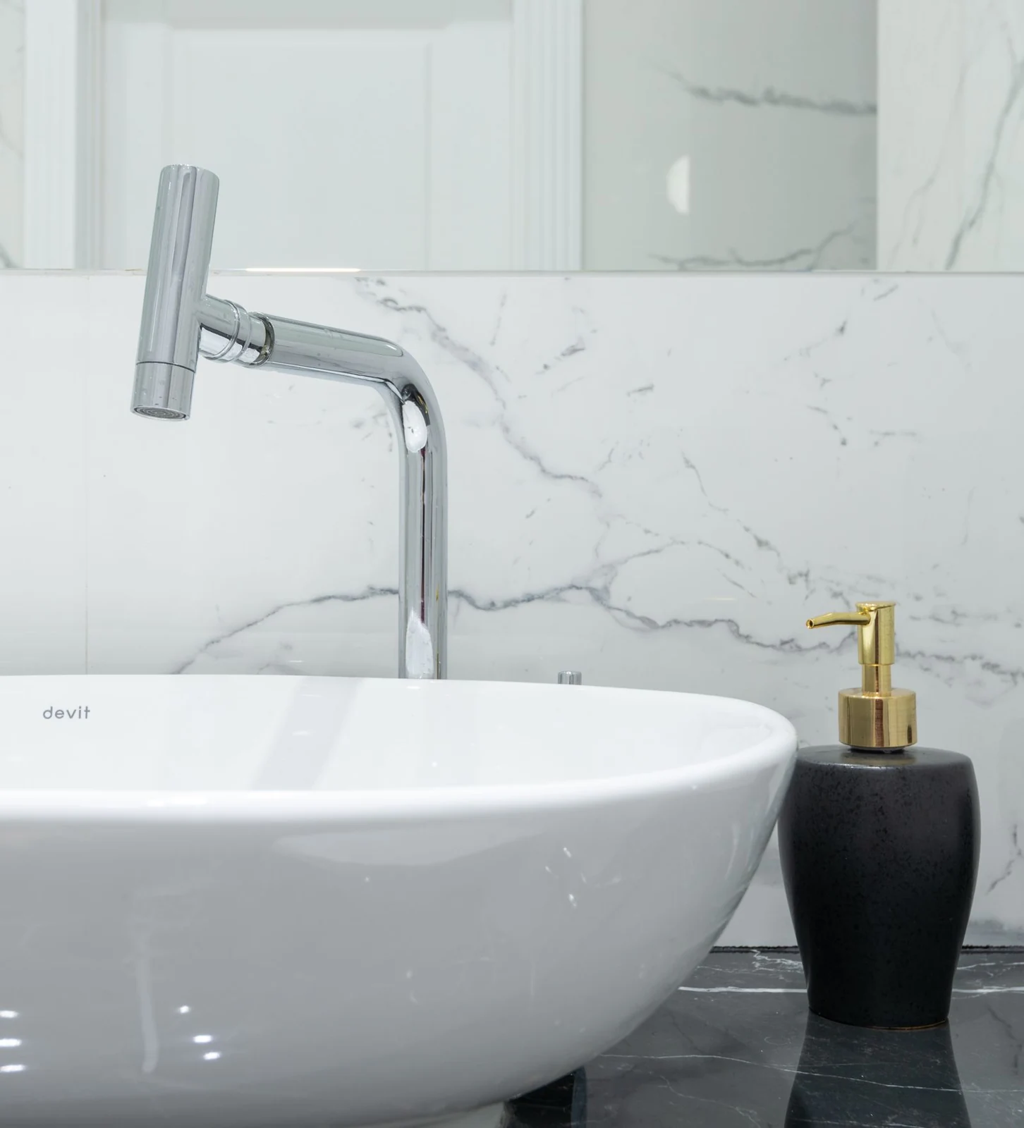 Basin and chrome bathroom tap